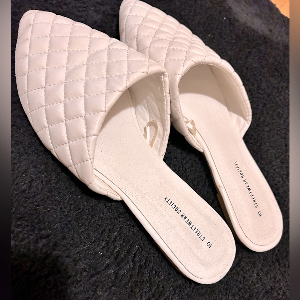 White quilted slip-ons